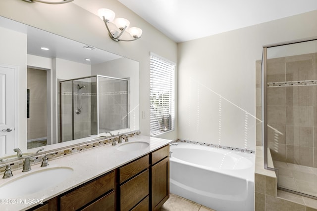 bathroom featuring vanity, tile patterned flooring, and plus walk in shower