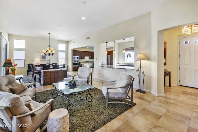 living room featuring a notable chandelier