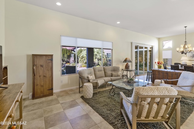 living room with french doors and an inviting chandelier