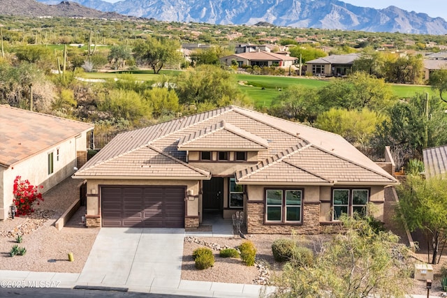 exterior space with a mountain view and a garage