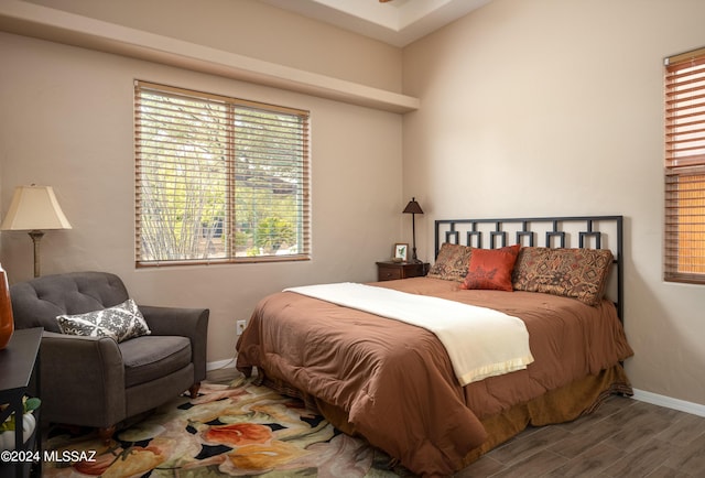 bedroom with hardwood / wood-style flooring