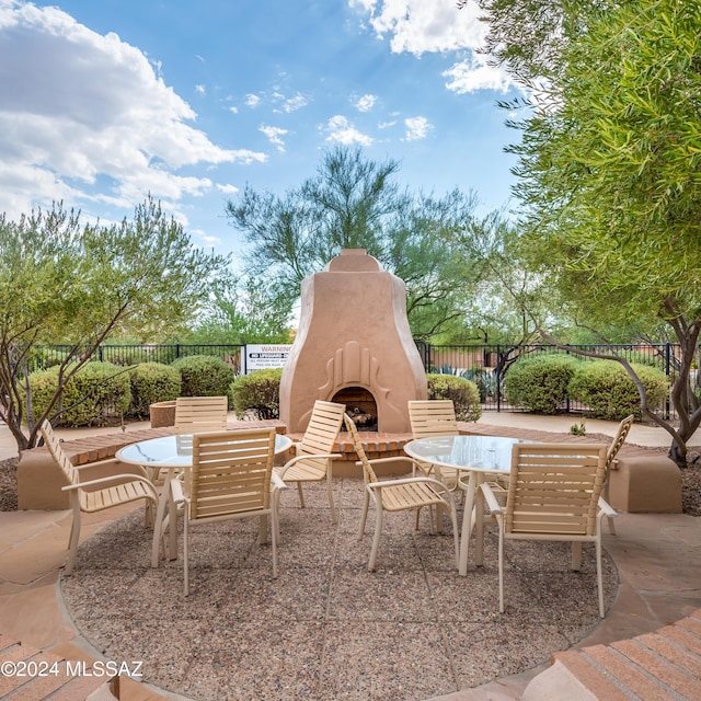 view of patio / terrace with exterior fireplace