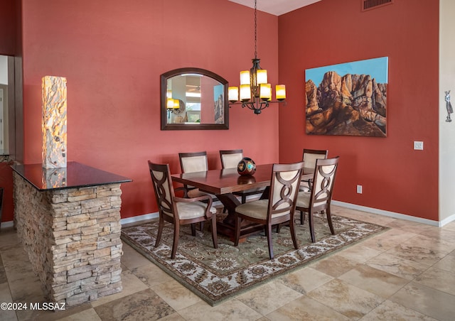 dining area with a notable chandelier