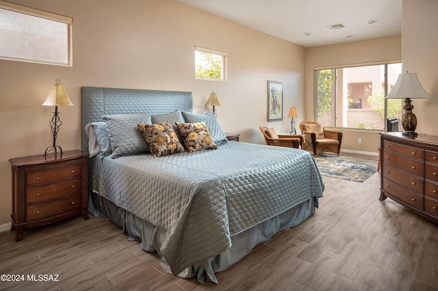 bedroom featuring multiple windows