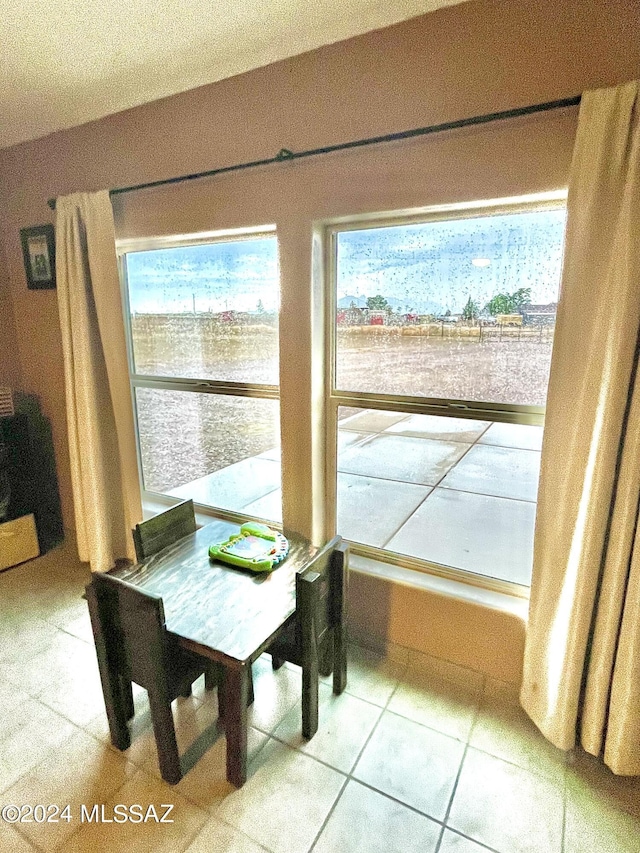 dining space with tile patterned floors