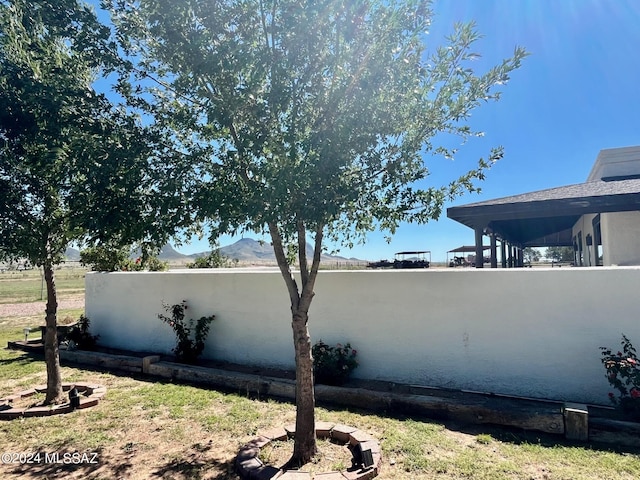 view of property exterior with a mountain view