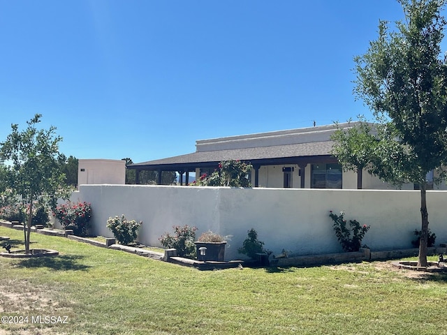 view of home's exterior featuring a yard