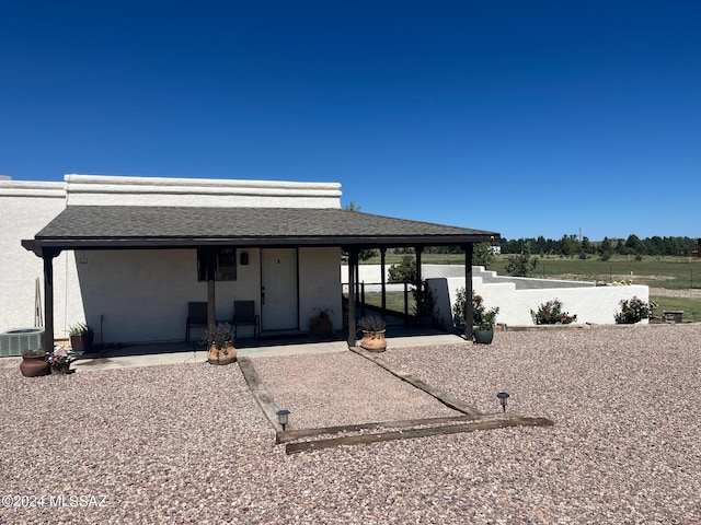 view of front of property featuring central air condition unit