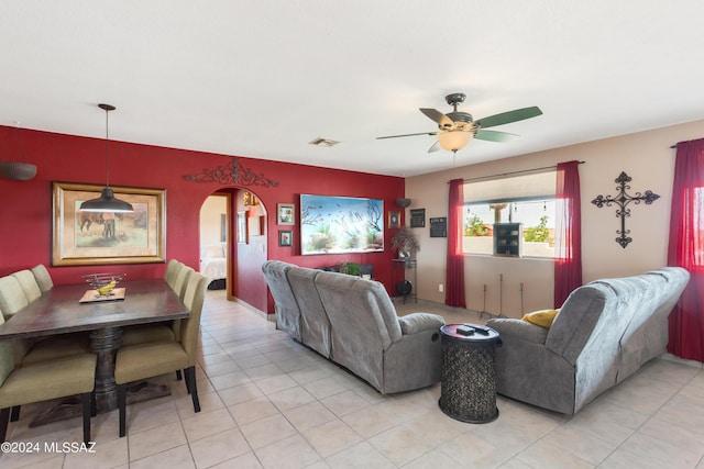 tiled living room featuring ceiling fan