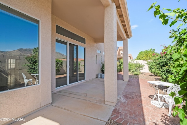 view of patio / terrace with a mountain view