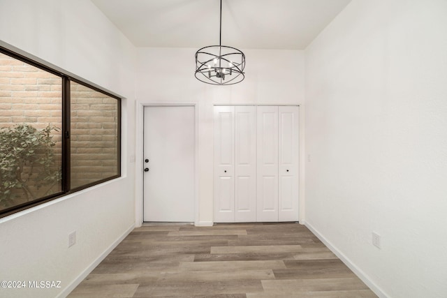 interior space featuring a notable chandelier and light hardwood / wood-style floors