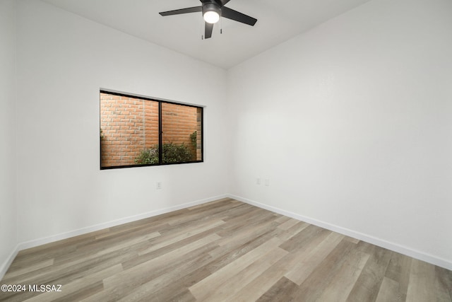 spare room featuring ceiling fan and light hardwood / wood-style flooring