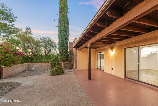 view of patio terrace at dusk