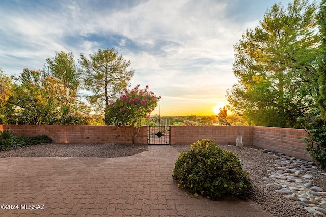 view of patio terrace at dusk