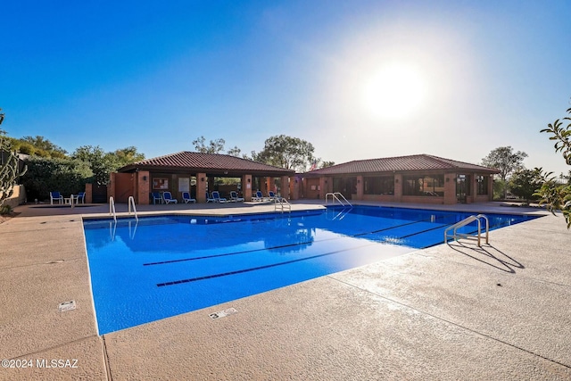 view of pool featuring a gazebo and a patio area