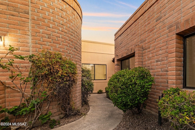 view of exterior entry at dusk