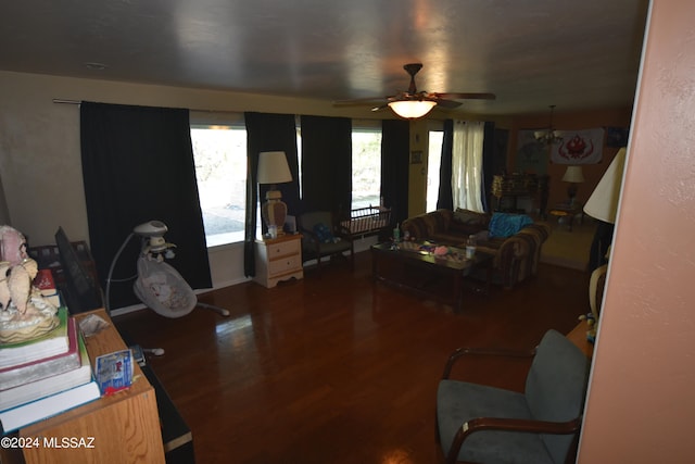 living room with ceiling fan and wood-type flooring