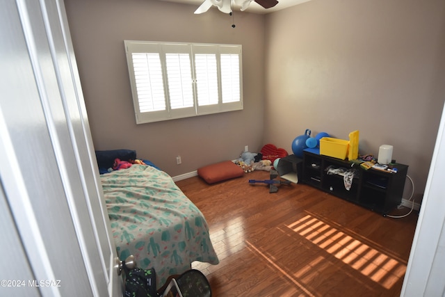 bedroom with hardwood / wood-style flooring and ceiling fan