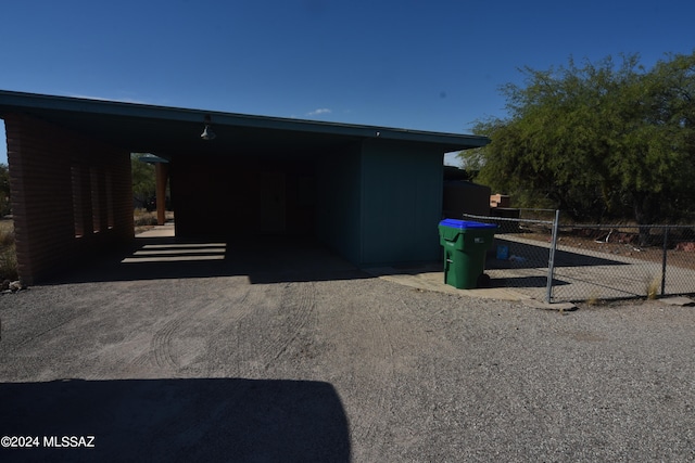 view of side of property with a carport