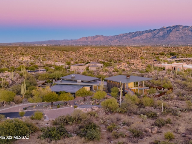 aerial view at dusk with a mountain view