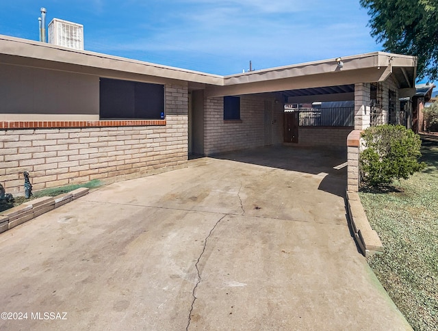 view of side of home featuring a carport