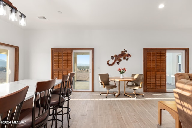 dining area featuring light wood-type flooring