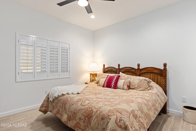 bedroom featuring light hardwood / wood-style flooring and ceiling fan