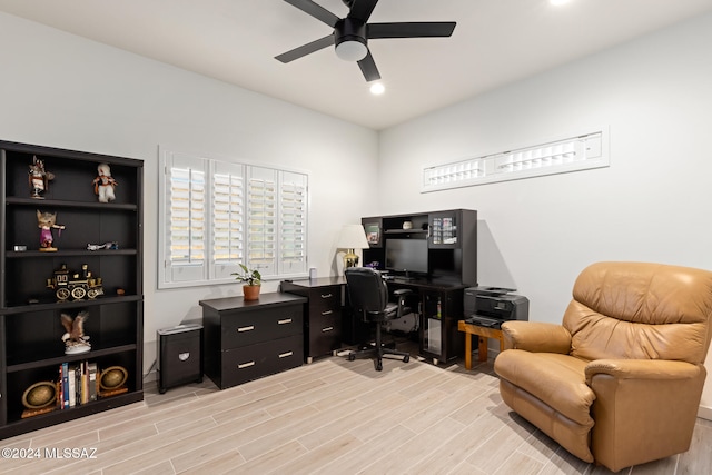 office with ceiling fan and light wood-type flooring