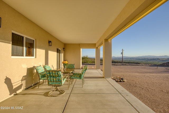 view of patio / terrace with a mountain view