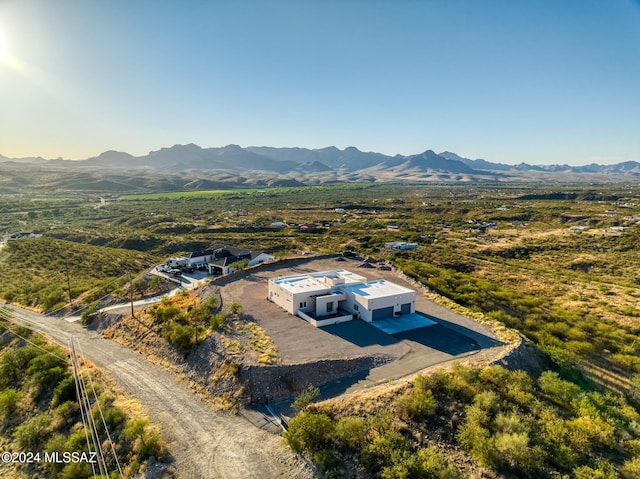 birds eye view of property with a mountain view