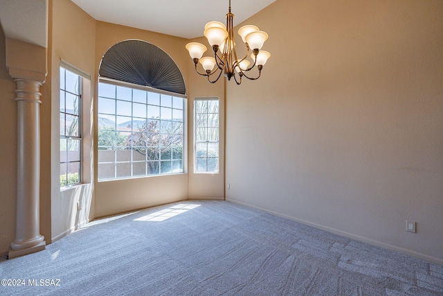 unfurnished room with an inviting chandelier and carpet