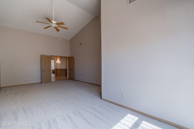 interior space with light carpet, high vaulted ceiling, and ceiling fan