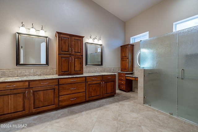 bathroom with walk in shower, lofted ceiling, vanity, and tile patterned floors