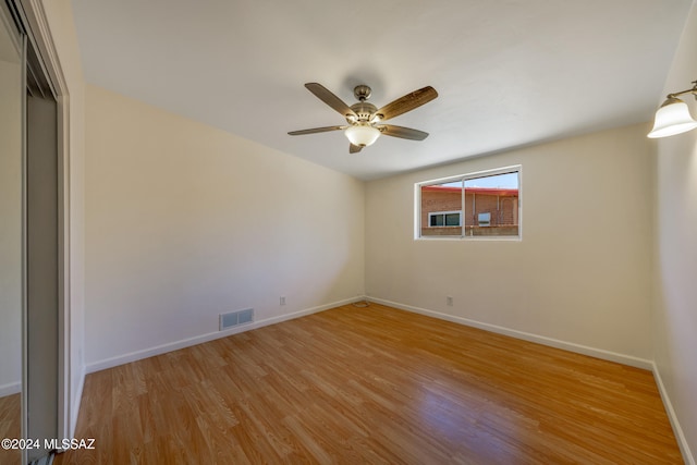 spare room with ceiling fan and light hardwood / wood-style floors