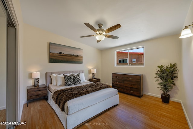 bedroom featuring light hardwood / wood-style flooring and ceiling fan