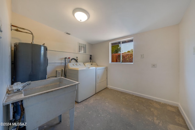 clothes washing area with sink and washer and dryer