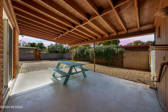 view of patio terrace at dusk