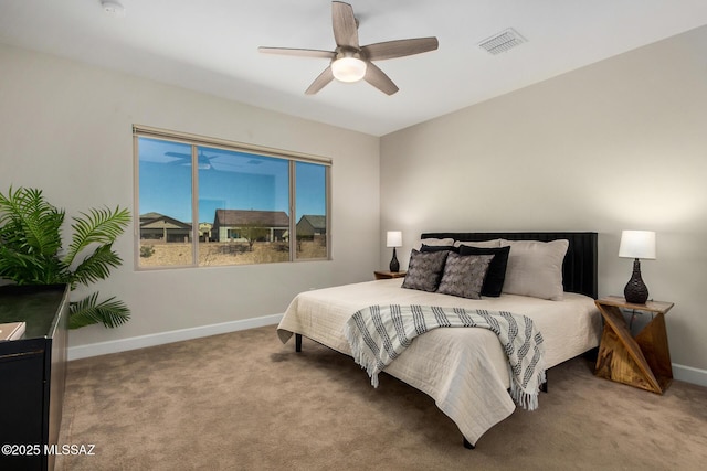 bedroom with carpet, visible vents, baseboards, and a ceiling fan