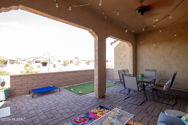 view of patio with a fenced backyard and outdoor dining space