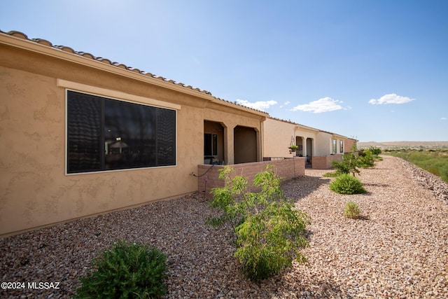 view of property exterior with stucco siding