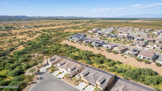 drone / aerial view with a residential view and a mountain view