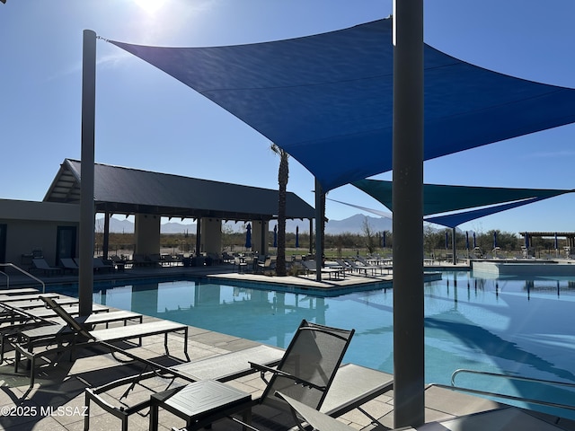 community pool with a patio area