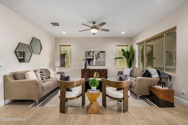 living area featuring ceiling fan, visible vents, baseboards, and recessed lighting