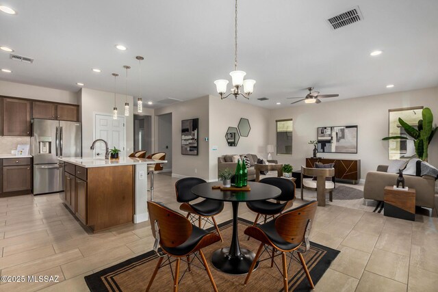 living room with light tile patterned floors and ceiling fan