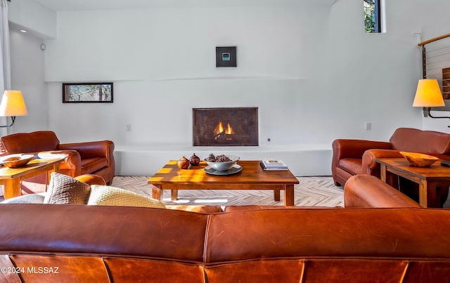 living area with a warm lit fireplace