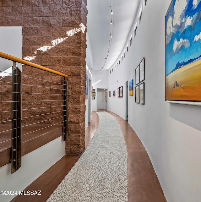 hallway featuring rail lighting