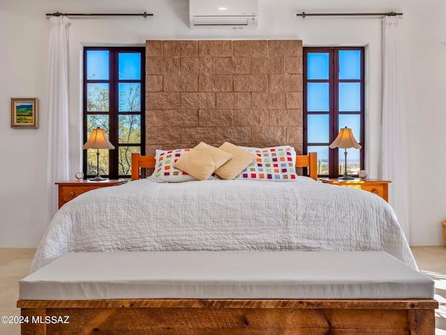 bedroom featuring a wall unit AC