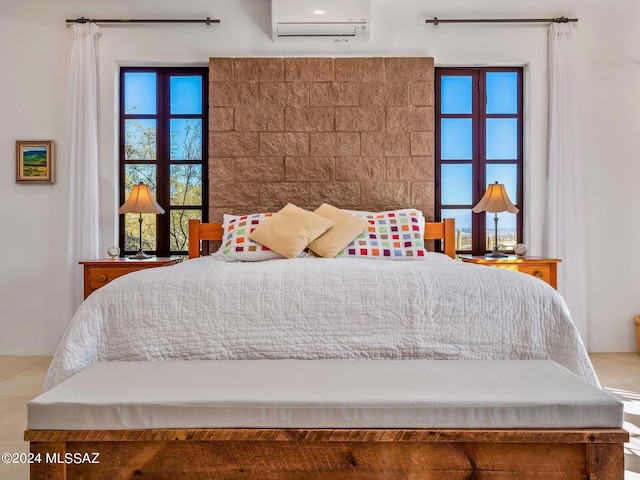 bedroom with a wall unit AC