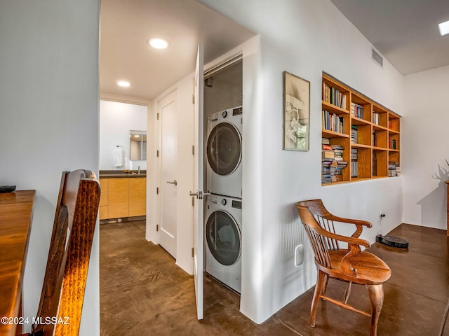 laundry room with stacked washer and dryer