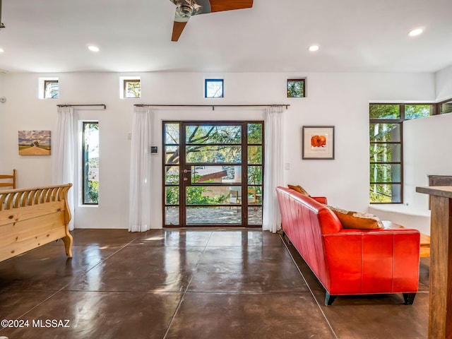 entryway with recessed lighting, plenty of natural light, concrete floors, and ceiling fan